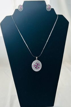 Sterling Silver Ruby and Zircon floral pendant necklace set.