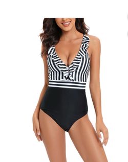 SHEIN women's one-piece swimsuit, black and white vertical striped design on the top with ruffles