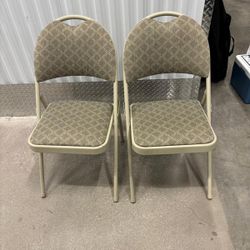 Two folding chairs with cloth padding in excellent condition like new.. $40 each
