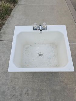 Laundry sink with faucet