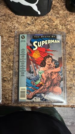 Two different copies death of Superman 1993 and black plastic bag death of Superman 1994 edition