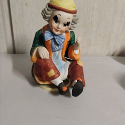 The Vintage ceramic or bisque clown figurine , OBO.