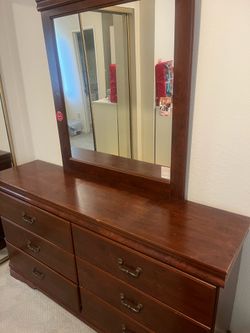 Serious buyers only. Cherry Finish Wood Dresser with Six Drawers and one night stand. $100