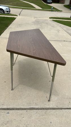Table for sale one side 4 feet 11 inches other side 2 feet 8 inches wide and 2 feet 6 inches tall but you can lower the height