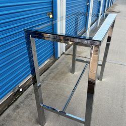 Brand New. Chrome Bar Table with tempered glass top. $149