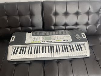 Casio keyboard and stand.