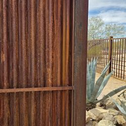 Rust Corrugated Metal Fence 