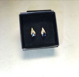 14k gold posts with blue sapphire and small diamond.