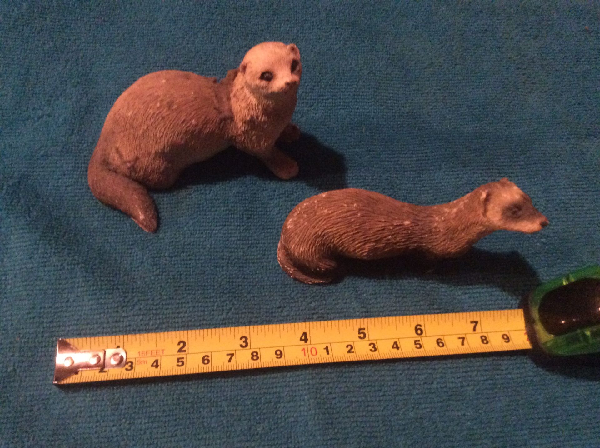 Two small ceramic animals. ( otters, beavers ?)