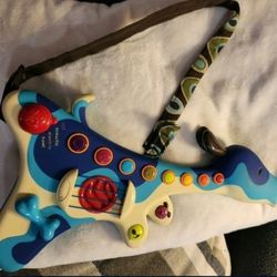 B. Toys Woofer Interactive Dog Guitar