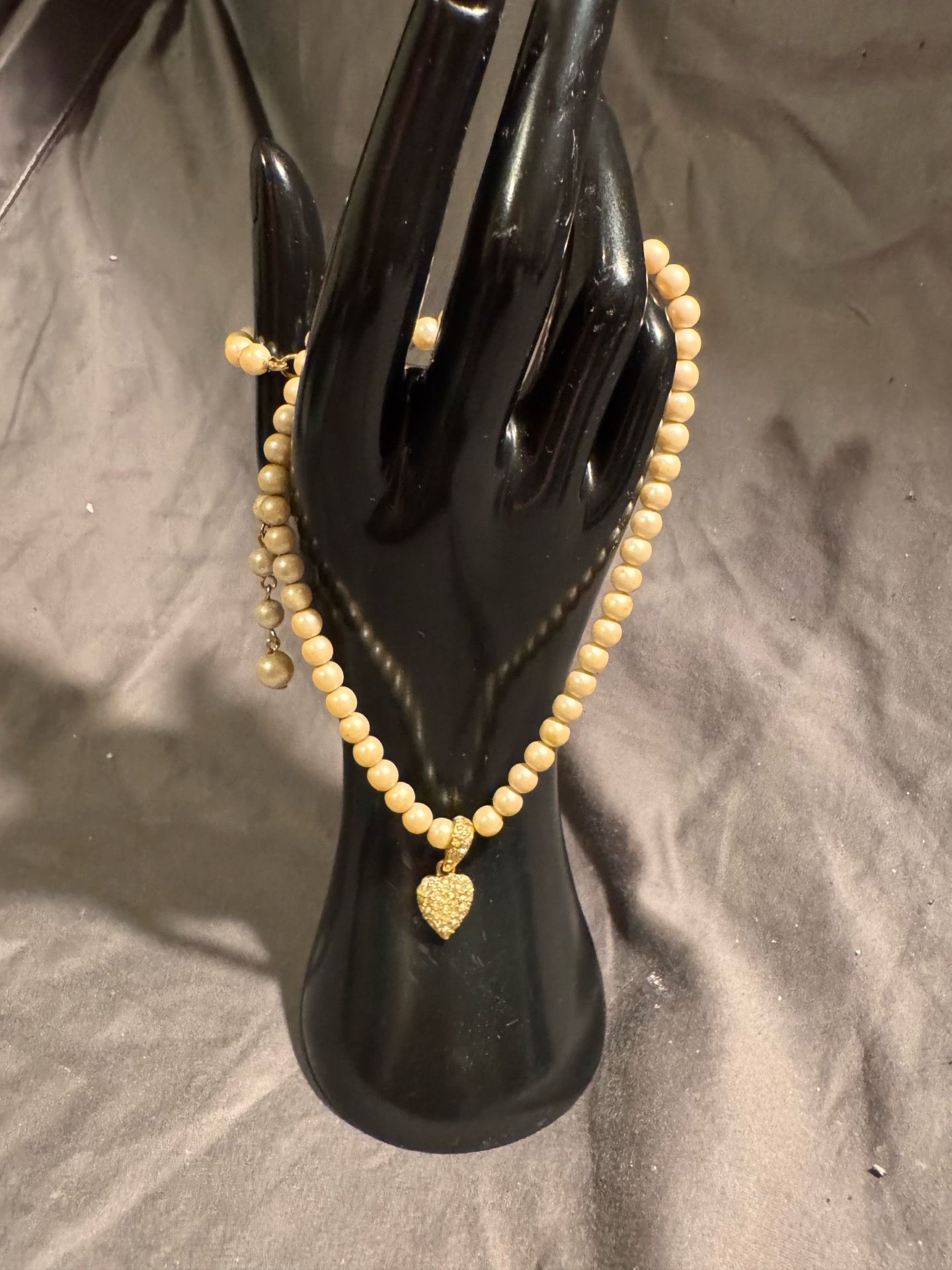 Faux pearls and heart charm