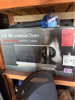 New unopened Over the Range Microwave