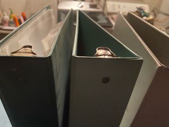 4 binders, some paper protectors