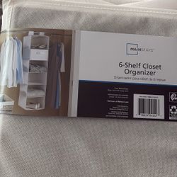 6 Shelf Closet Organizer.   New. $8.  