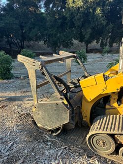 Tree mulcher skid steer loader
