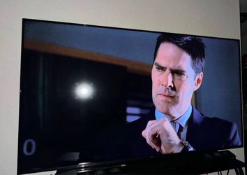 70' Hisense Smart Tv with a remote