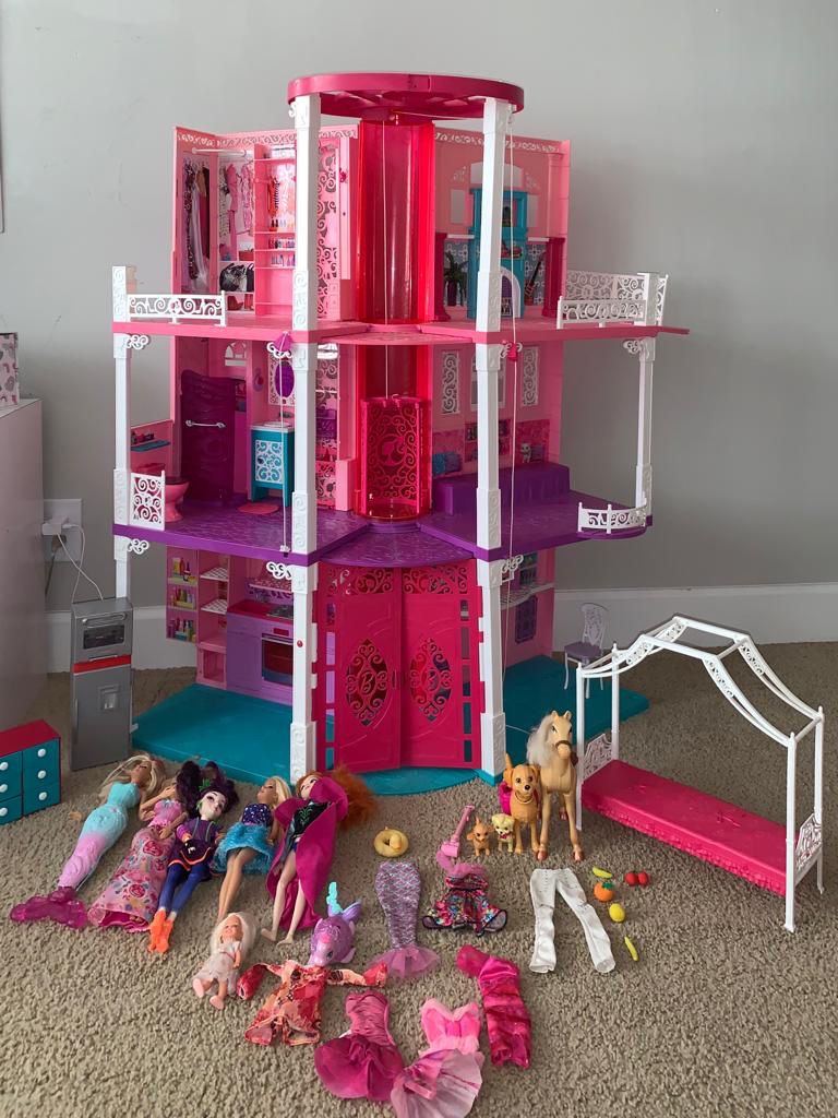 barbie doll house 3 floors with elevator (includes all dolls and dresses)