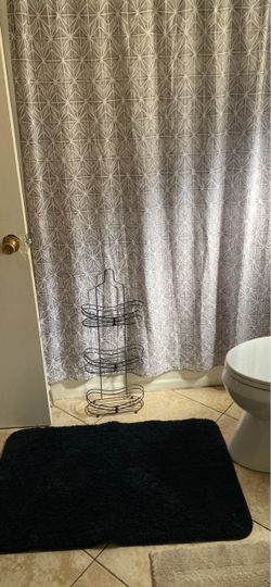 Shower curtain, rug and shower rack