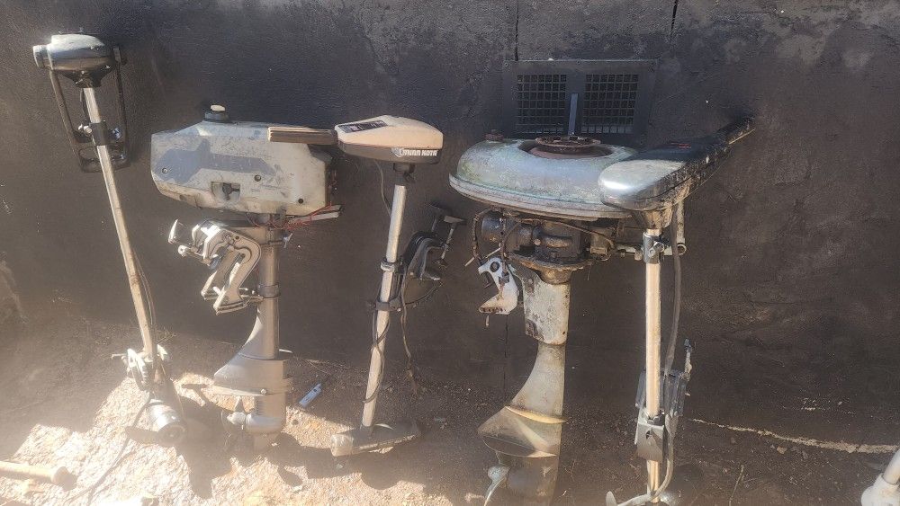 Trolling Motors And Two Small Outboard Engines