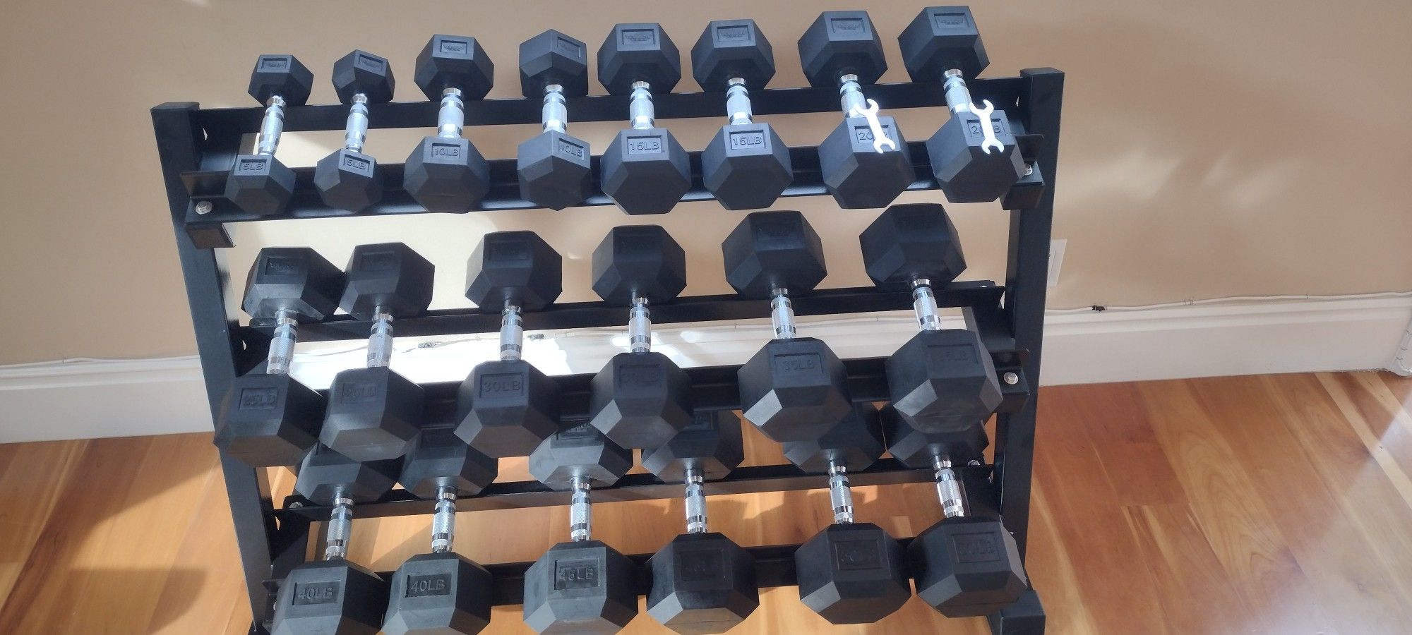 RUBBER HEX DUMBBELLS SET:
5-50lb. WITH THE RACK.