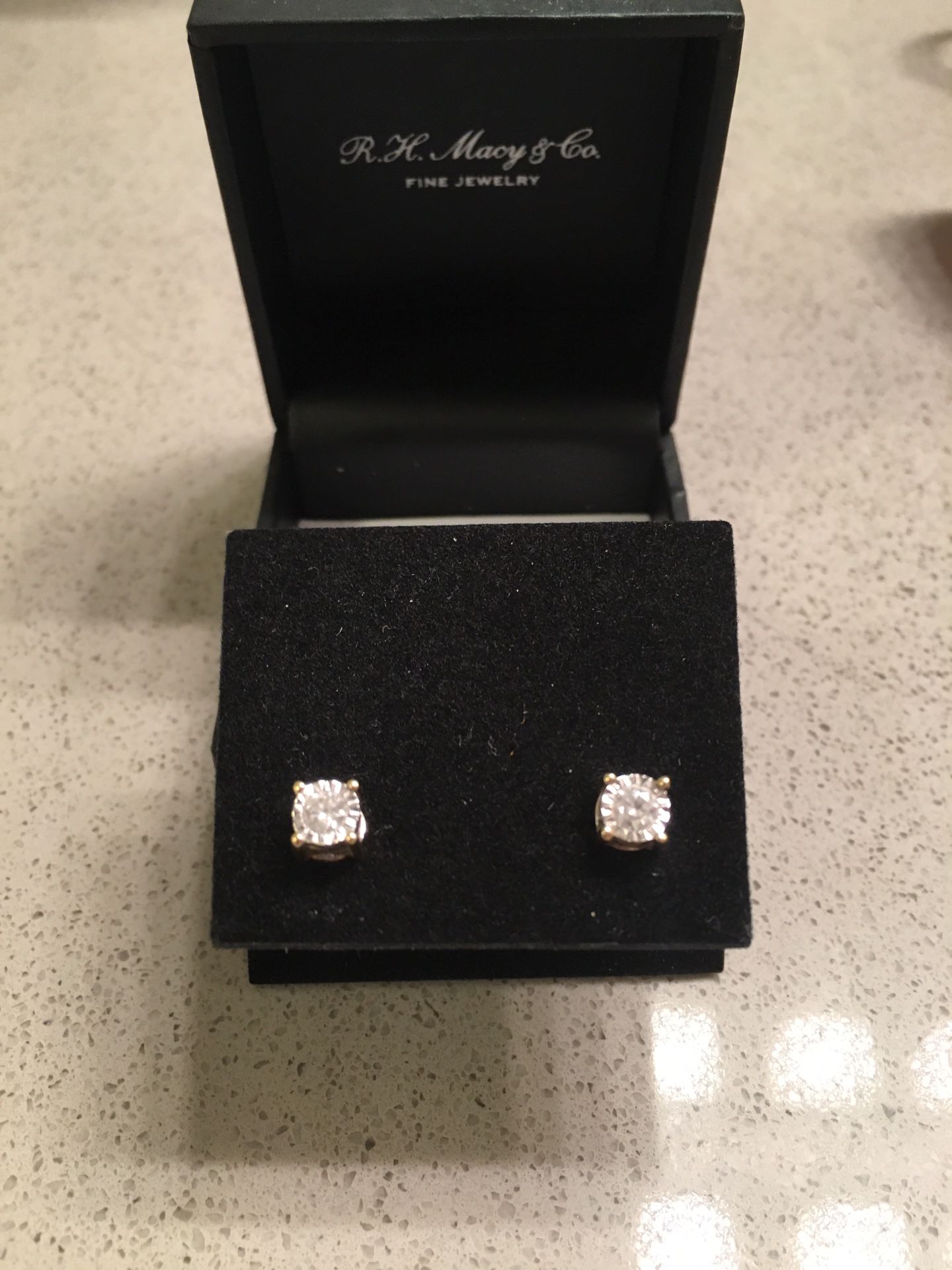 Diamond earrings from Macy’s with tag