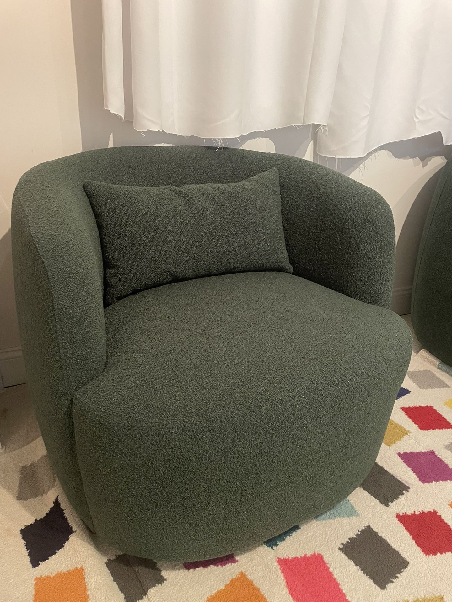 Two Green Bouclé Swivel Chairs