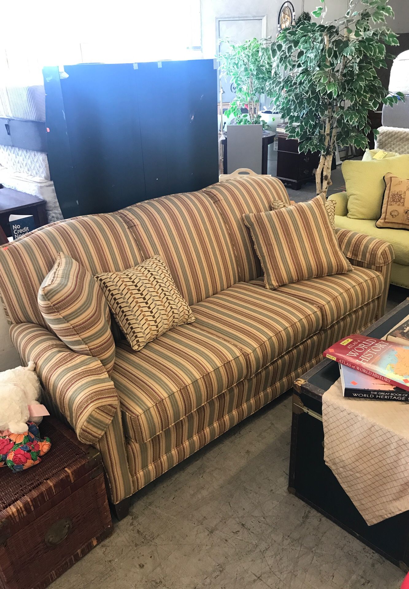 Nice tan couch with pillows