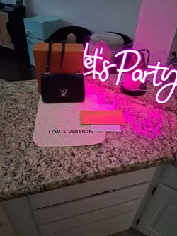 Louis Vuitton Lockme Leather Handbag