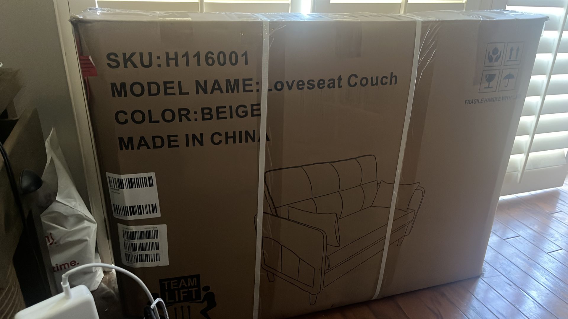 Beige loveseat couch in original packaging!
