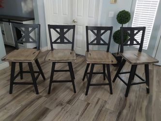 Four counter height swivel bar stools