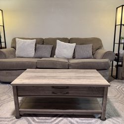 Comfortable Gray Couch, Coffee Table With Storage And Black Floor Lamps With Display Shelves