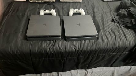 2 Perfect Condition PS4s Both With a White Controller