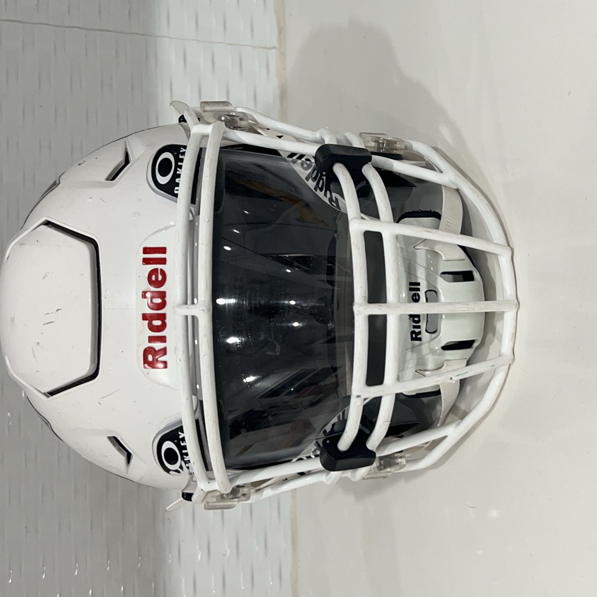 White Riddell speedflex Football Helmet with Oakley visor