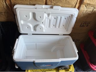 Coleman blue ice chest with cup holders and wheels