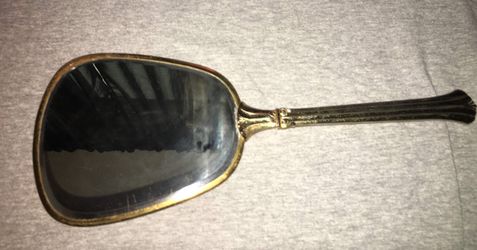 Vintage gold tone embossed hand held mirror