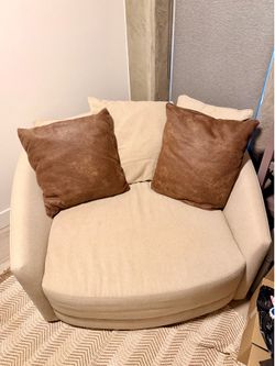 Living spaces color sand Swivel Oversized Cuddler