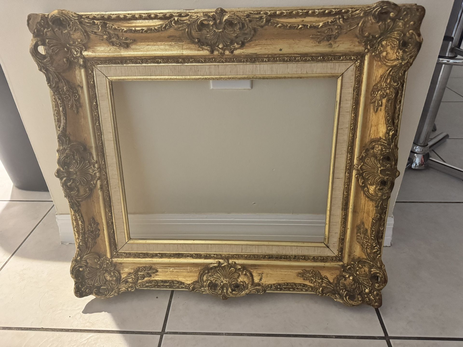 “Gold Antique baroque-style frame”
