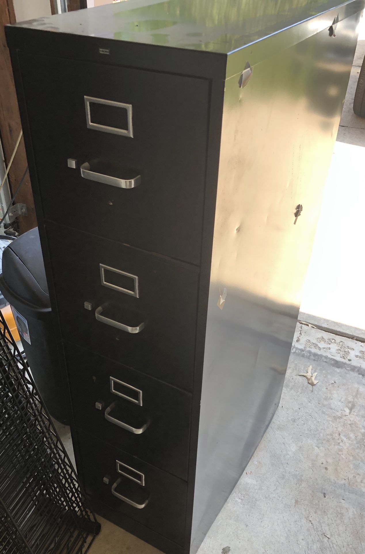 Used black metal HON 4 drawer file cabinet