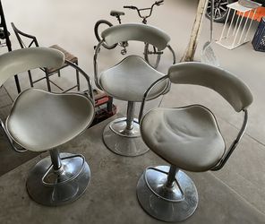 3 white barstool seats