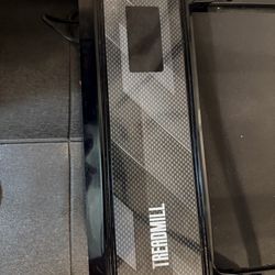 Treadmill with remote and mat