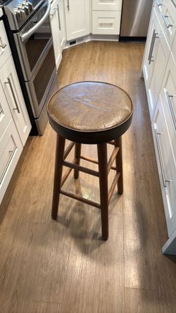 Matching set of 2 solid wood bar stools in good condition.