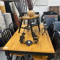 Brown and black dinning table with 6 chairs