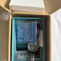 AVI-8 pilot watch with a striking blue-green luminous dial.