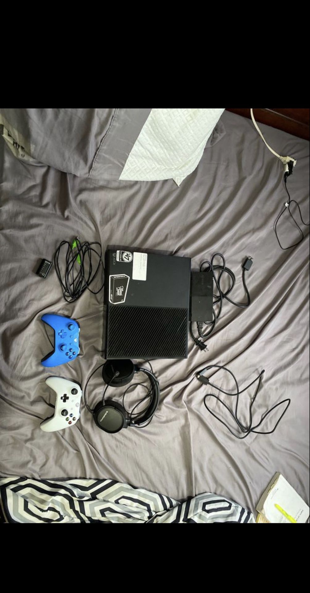 Xbox, two controllers, steel series headset, charging cord and charging pack