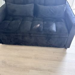 Blue Velvet convertible sleeper sofa bed with a pull-out bed mechanism 