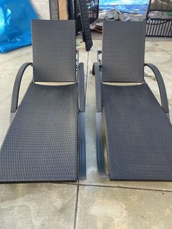 Two Chaise Lounge outside chairs with cushions