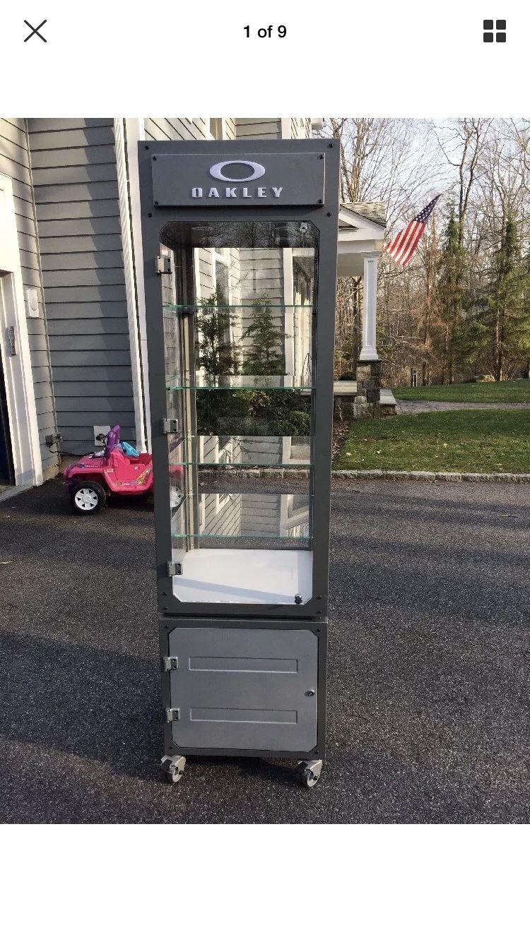 Oakley display case with shelving and lights