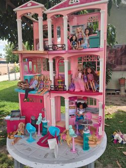 Barbie house with barbies and accessories