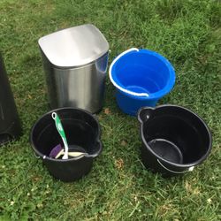 Two Garbage  Bins And Three Cleaning  Items To Help Cleaning Easier 