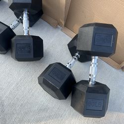 new  pair of 55lb and 60lb rubber dumbbells  $230
